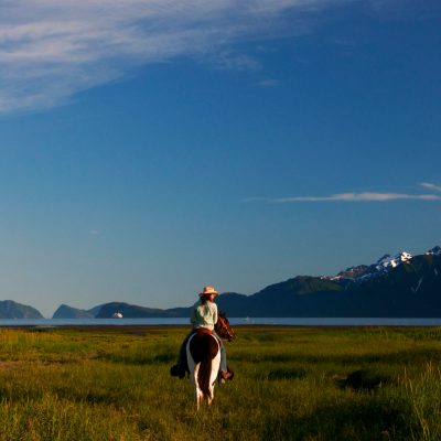 Breanna Bardarson horseback riding near Resurrection Bay, Seward, Alaska.